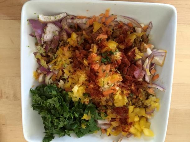 Fish marination: shredded carrots, onions, bell peppers, garlic, cilantro, cumin, coriander, salt and pepper.