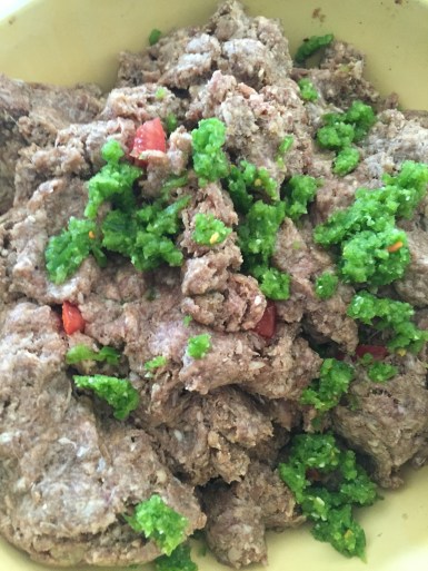 Ground beef with spices, onions, minced garlic and minced bell pepper